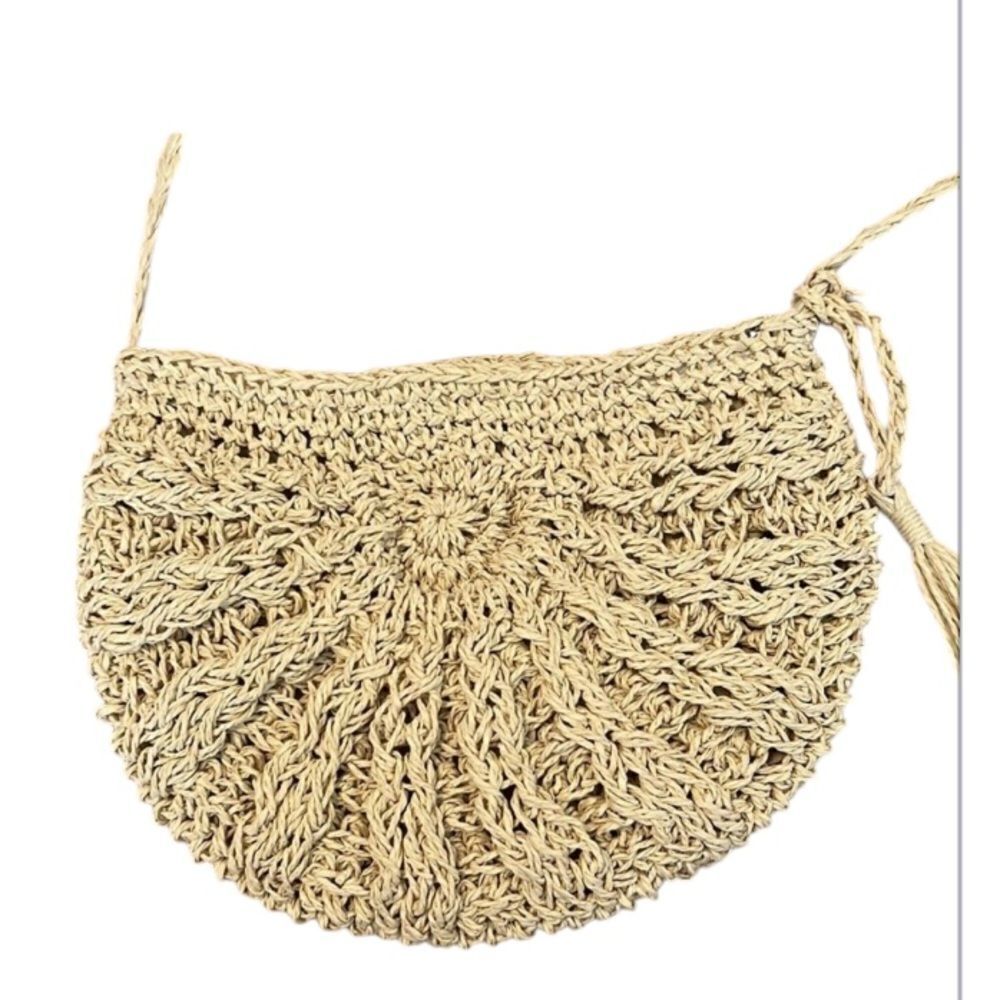 Cute tan straw crossbody bag very roomy for its size Gives me beachy vibes EUC